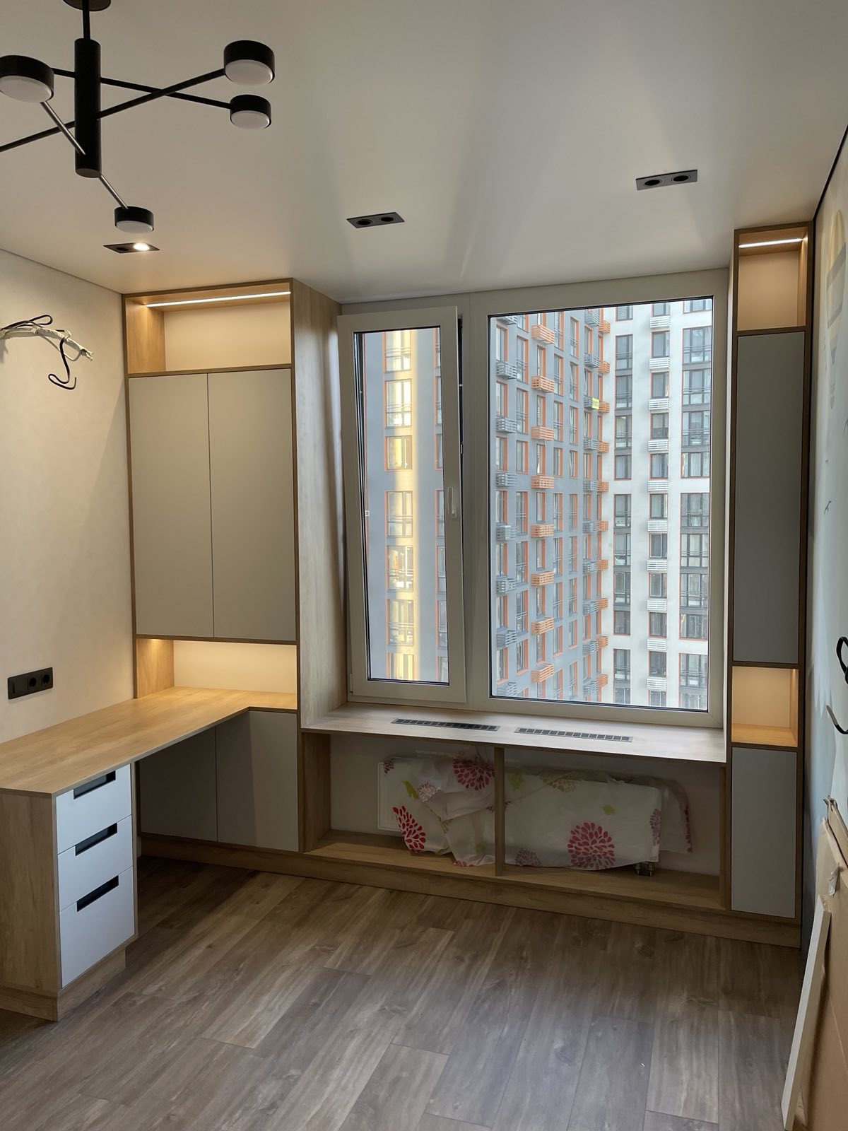 Custom window desk and storage joinery