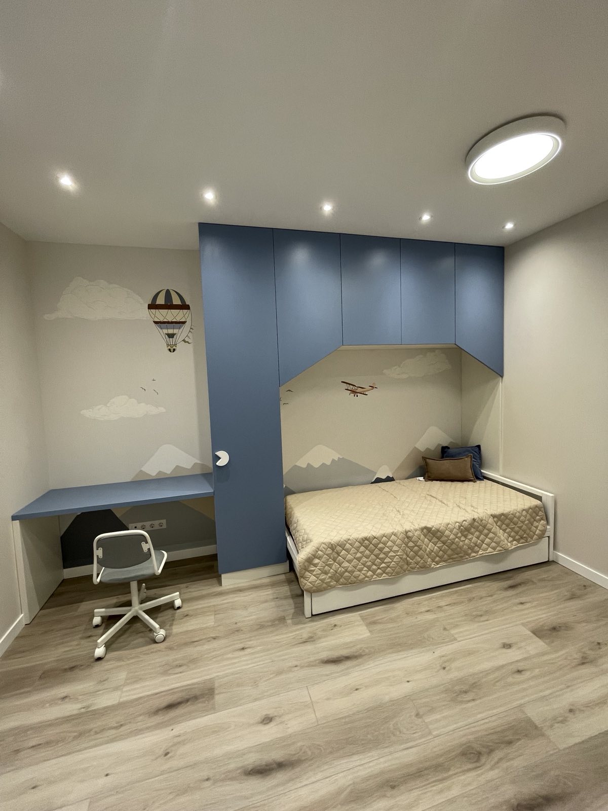 Blue bedhead joinery with bedroom storage