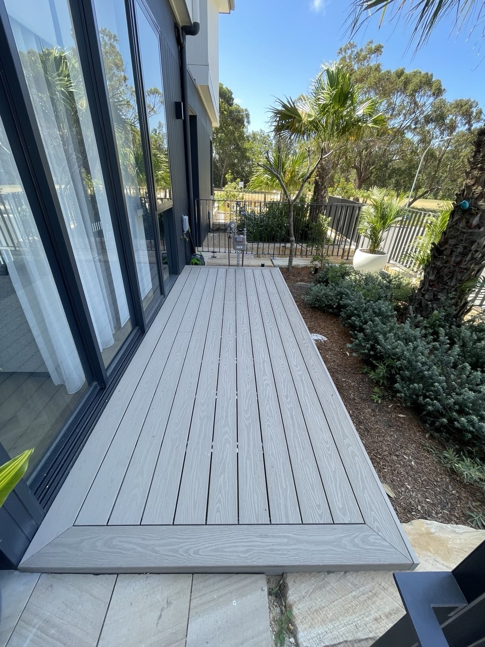 Grey outdoor boardwalk decking with clean edge detailing