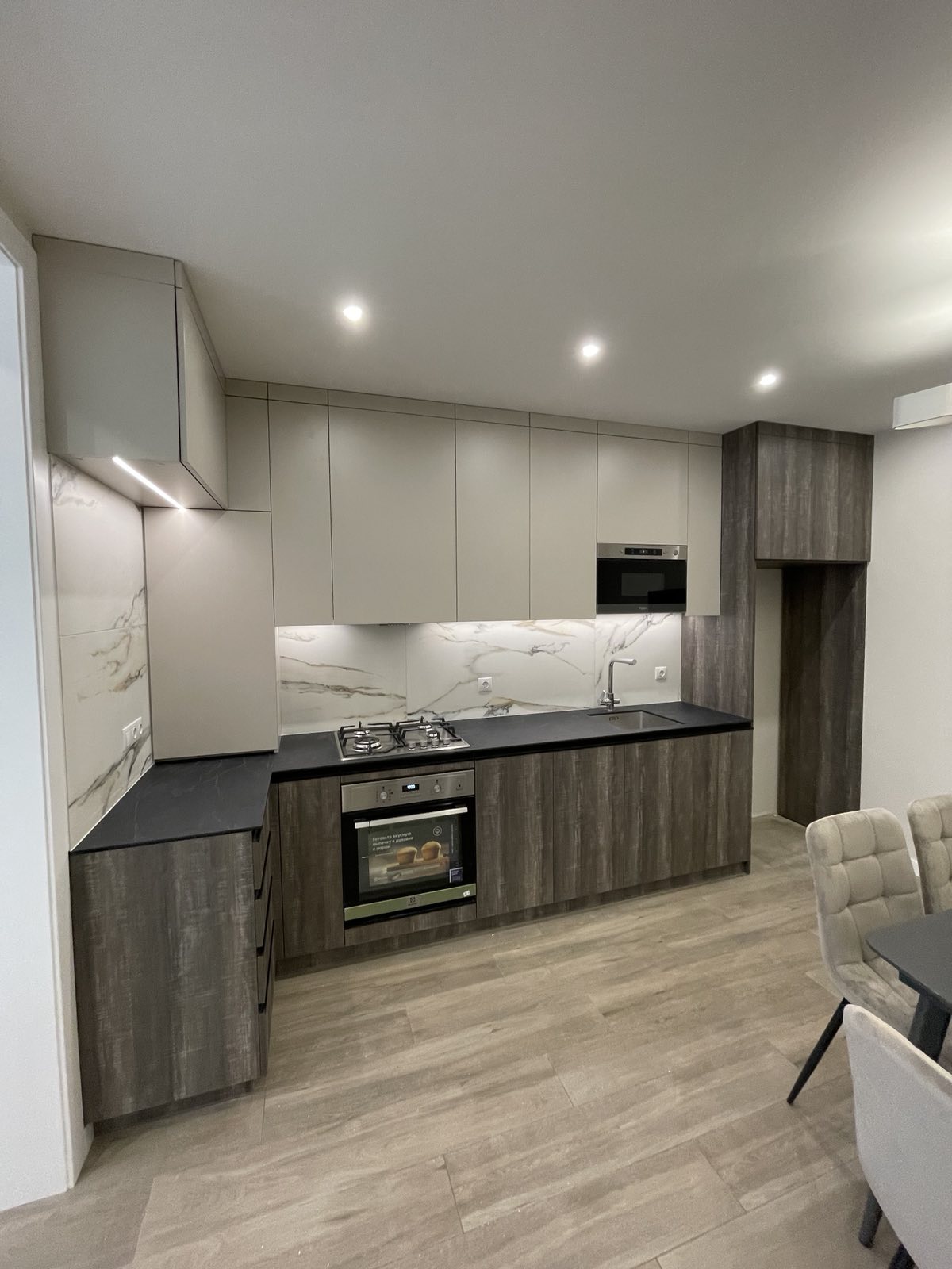 Compact kitchen joinery with timber and grey cabinetry