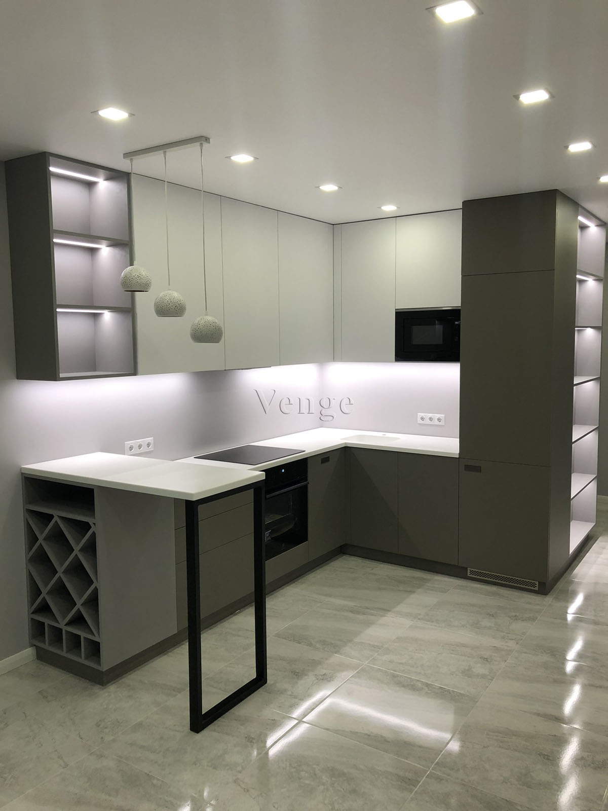 Dark kitchen peninsula joinery with light benchtop