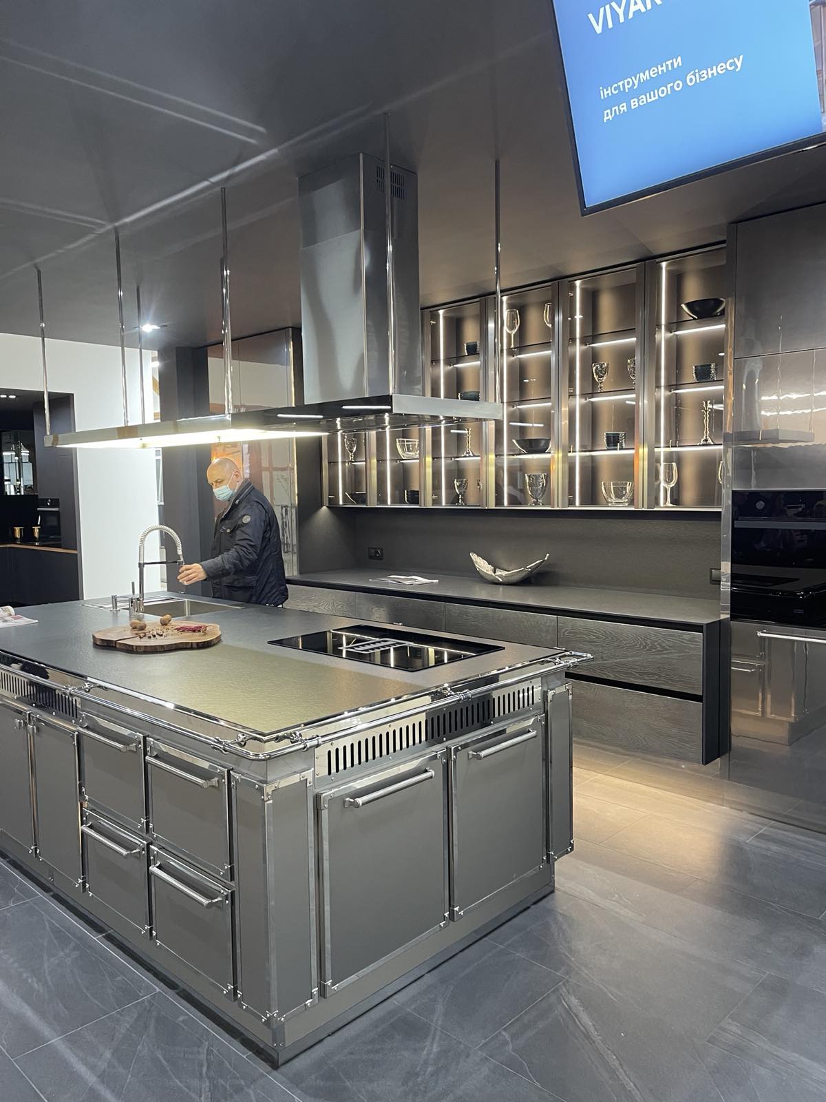 Moody kitchen joinery with dark cabinetry and feature detailing