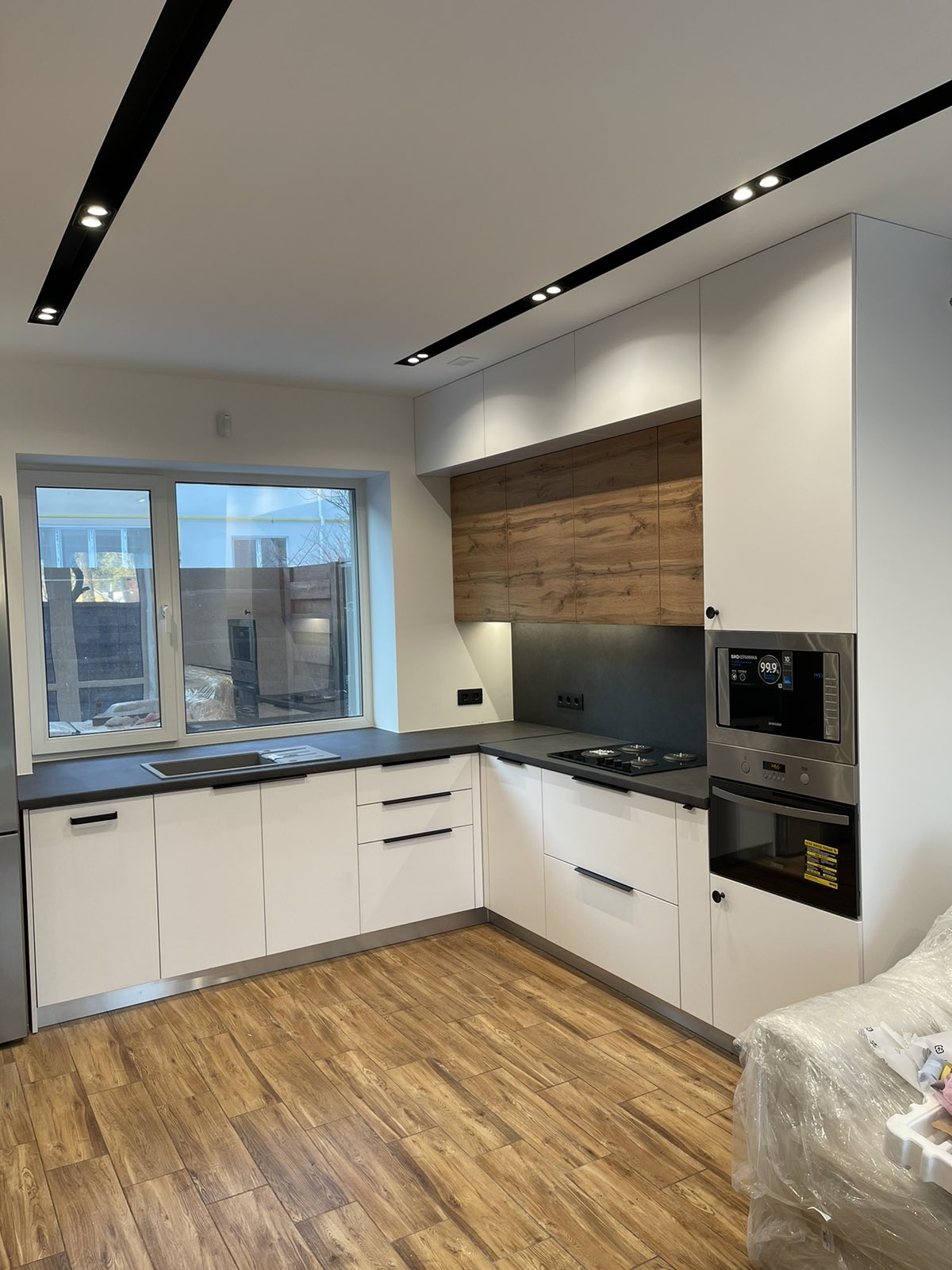 White Kitchen With Timber Feature Wall portfolio image 2