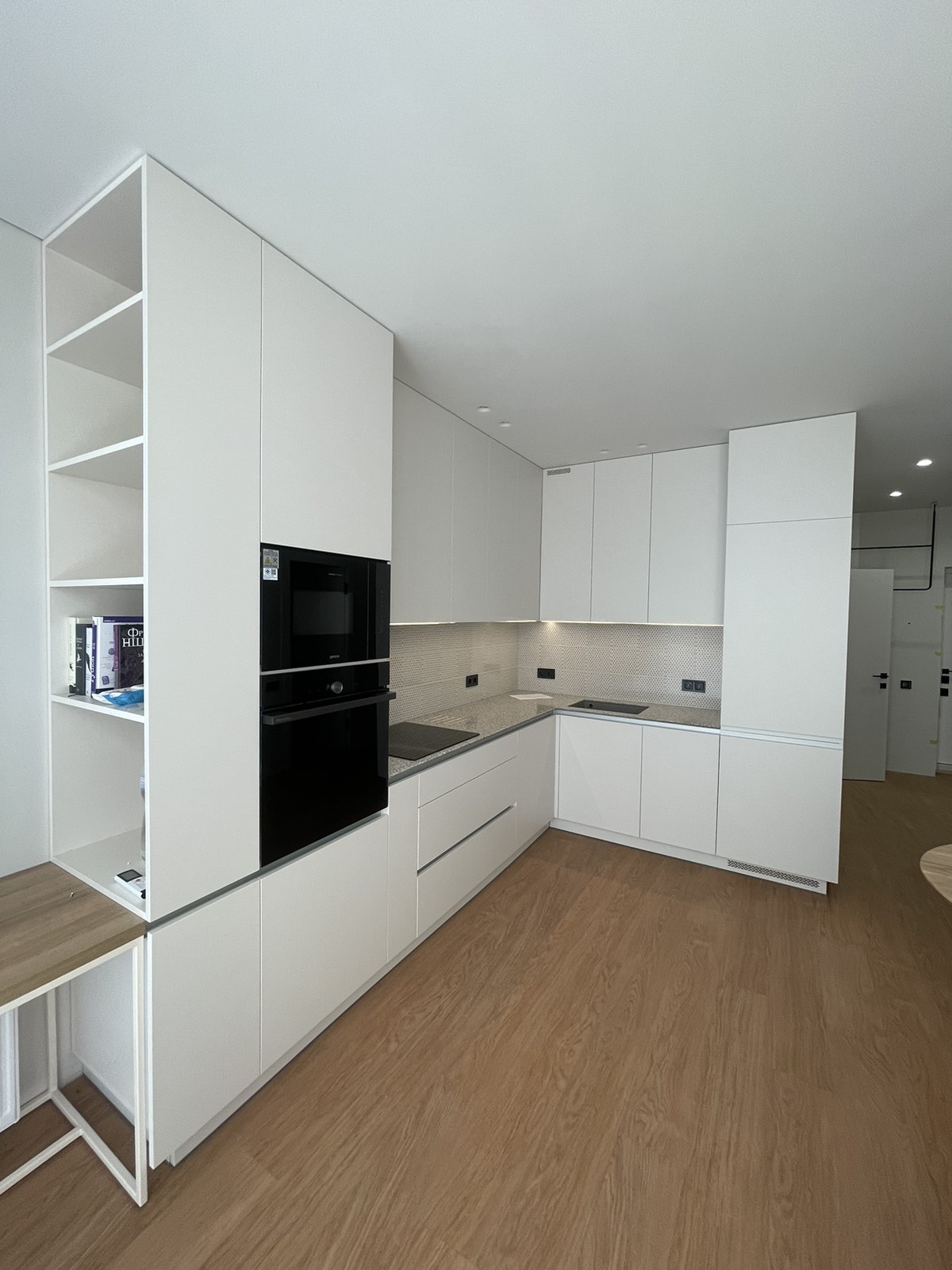 White wall kitchen joinery with integrated shelving