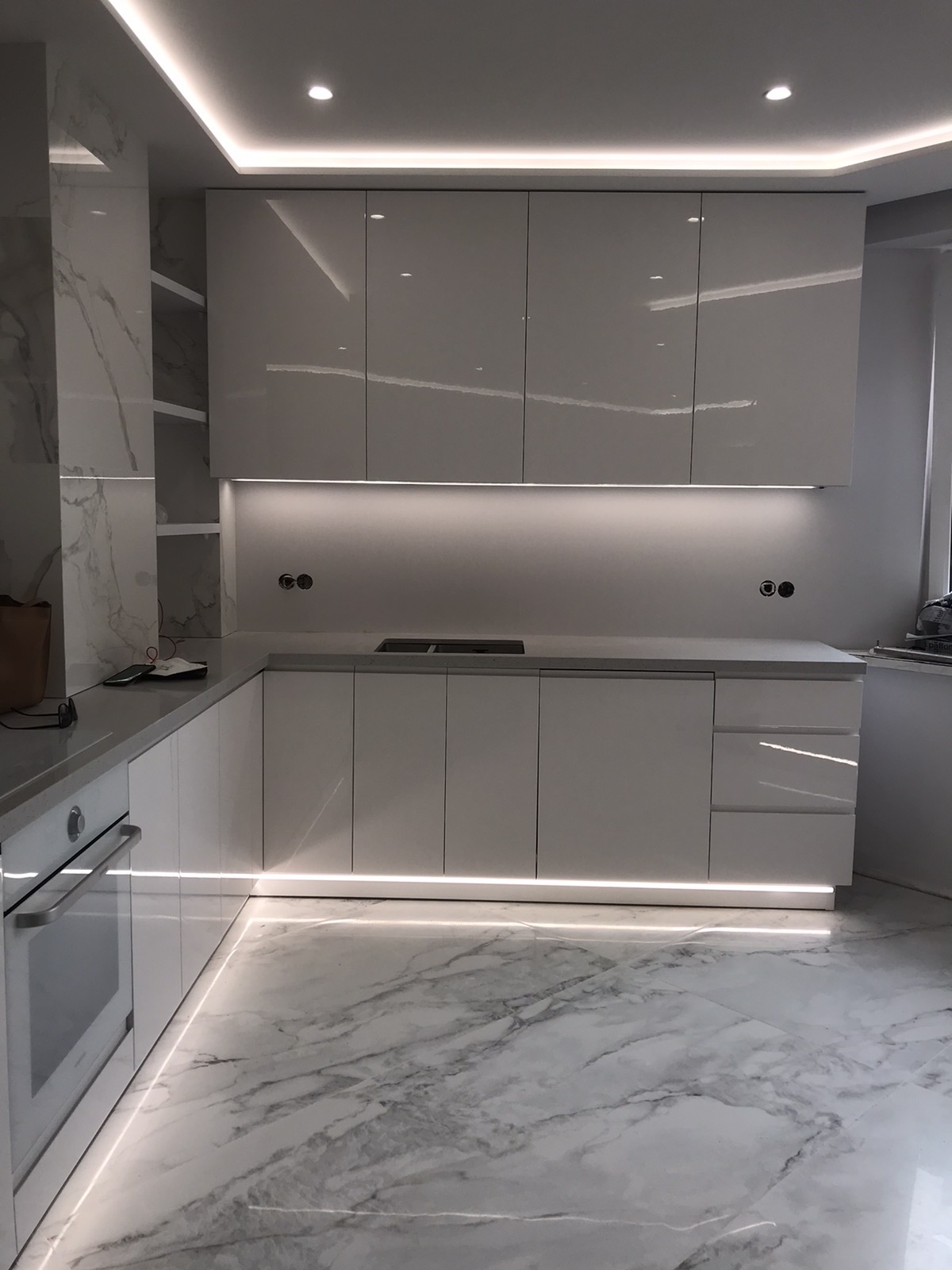 Minimal white kitchen joinery with clean cabinet fronts