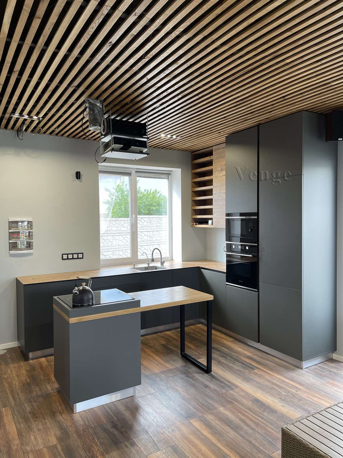 Kitchen joinery with timber ceiling feature and island bench