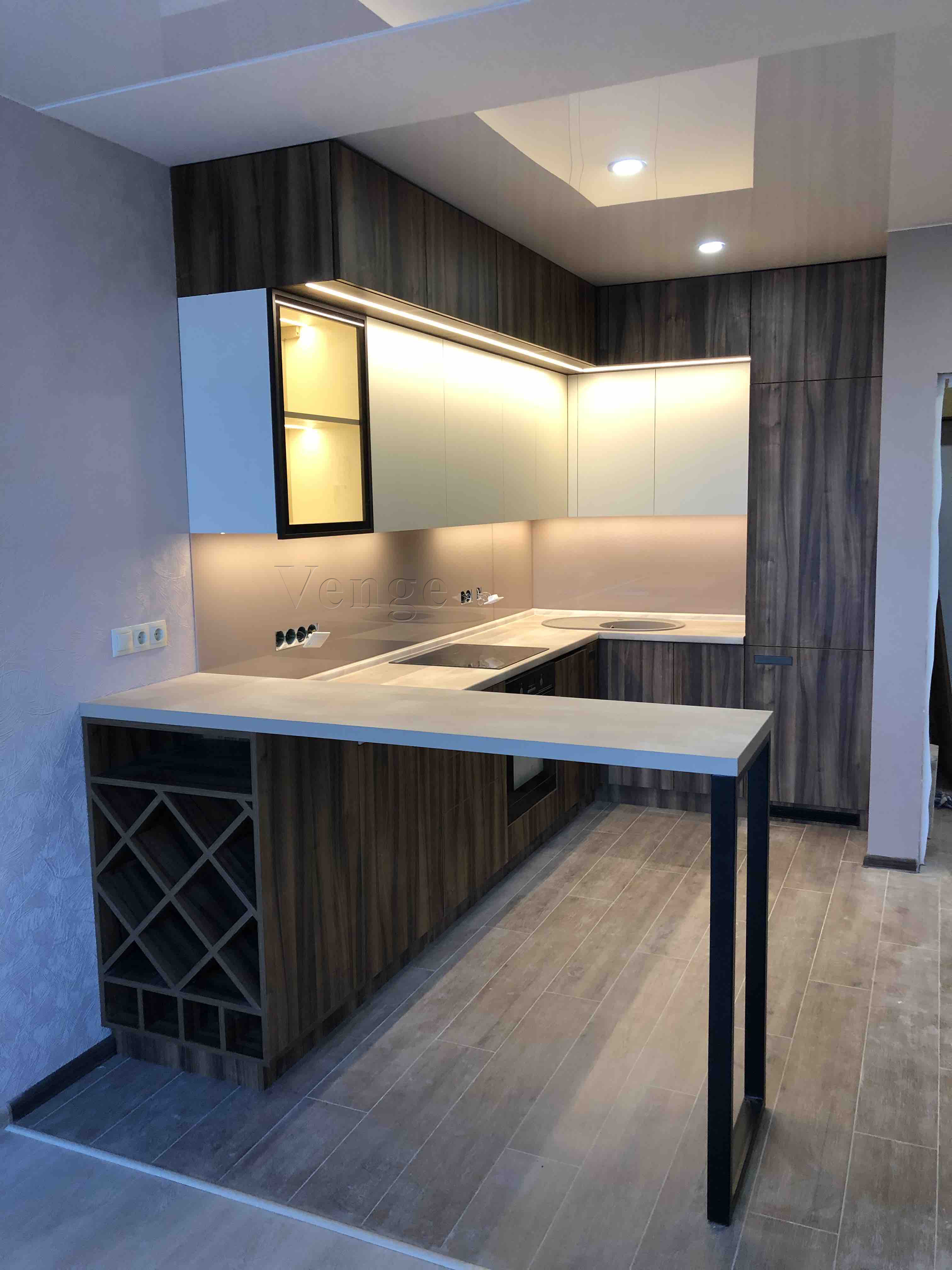 Kitchen breakfast bar joinery with dark cabinetry