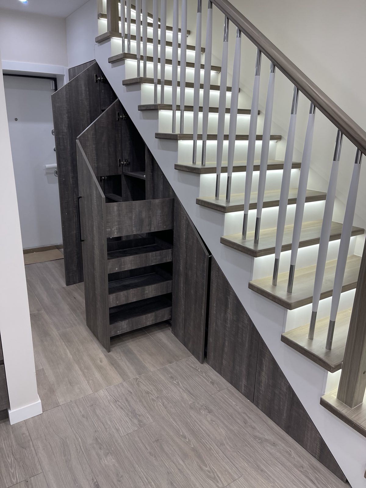 Stair joinery with balustrade and lower storage detail