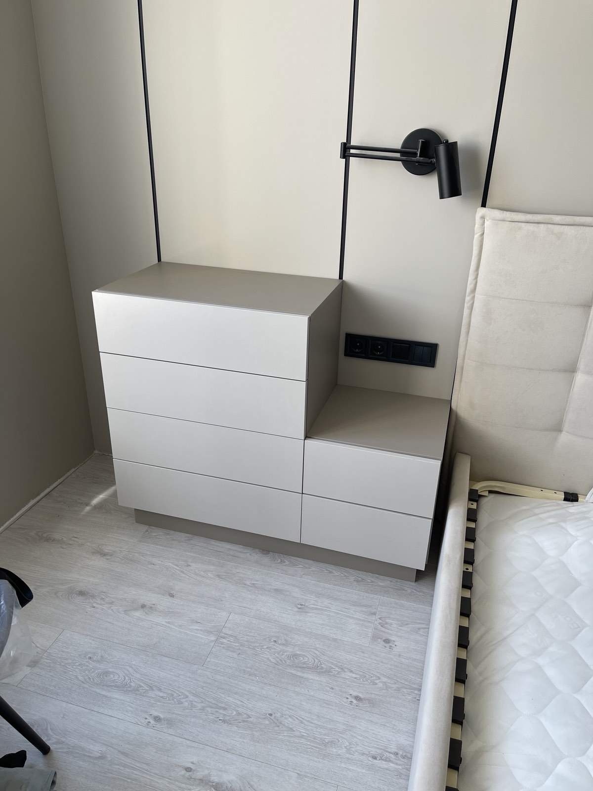 Compact white bedroom drawer and bedside joinery